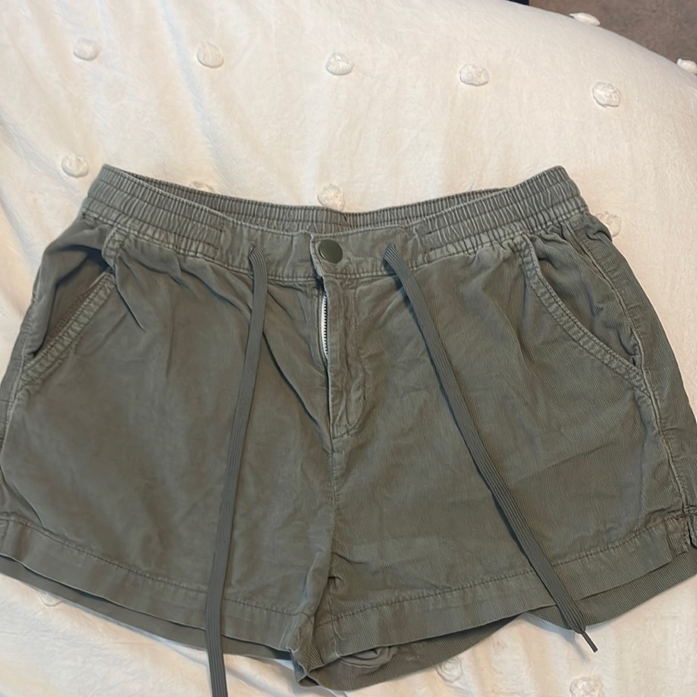 Army green corduroy shorts.